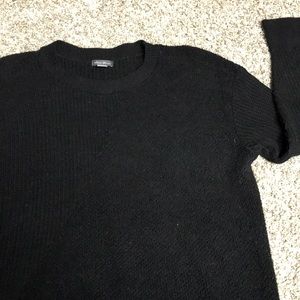Black Eddie Bauer sweater with asymmetrical design